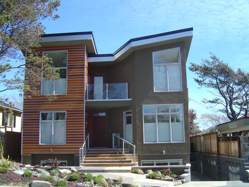 A modern two-storey house with large windows